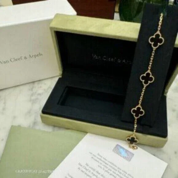 Van Cleef & Arpels 18K gold onyx 5-flower bracelet